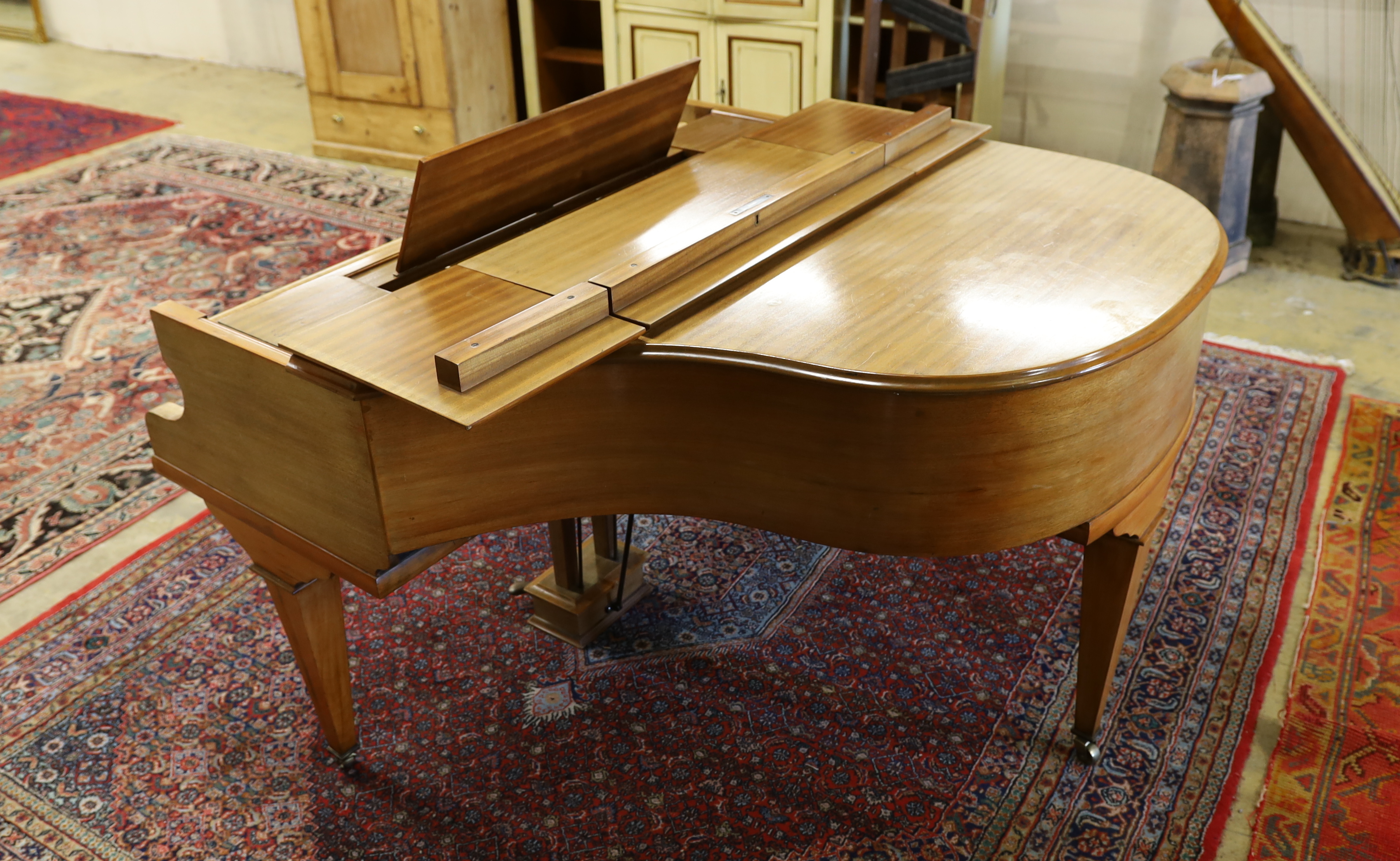 A mid 20th Cecilian & Co mahogany baby grand piano retailed by Harrods Ltd
